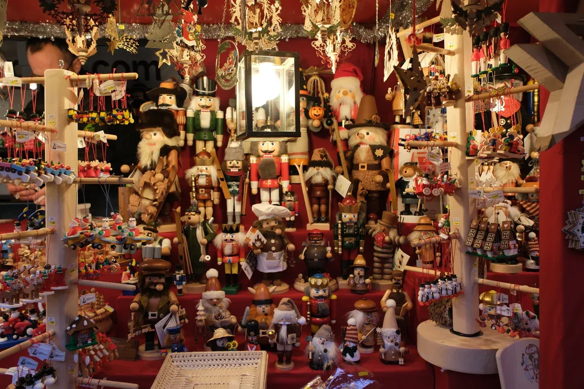 A stall of wooden nutcrackers, smokers and glass ornaments at the Christkindlesmarkt
